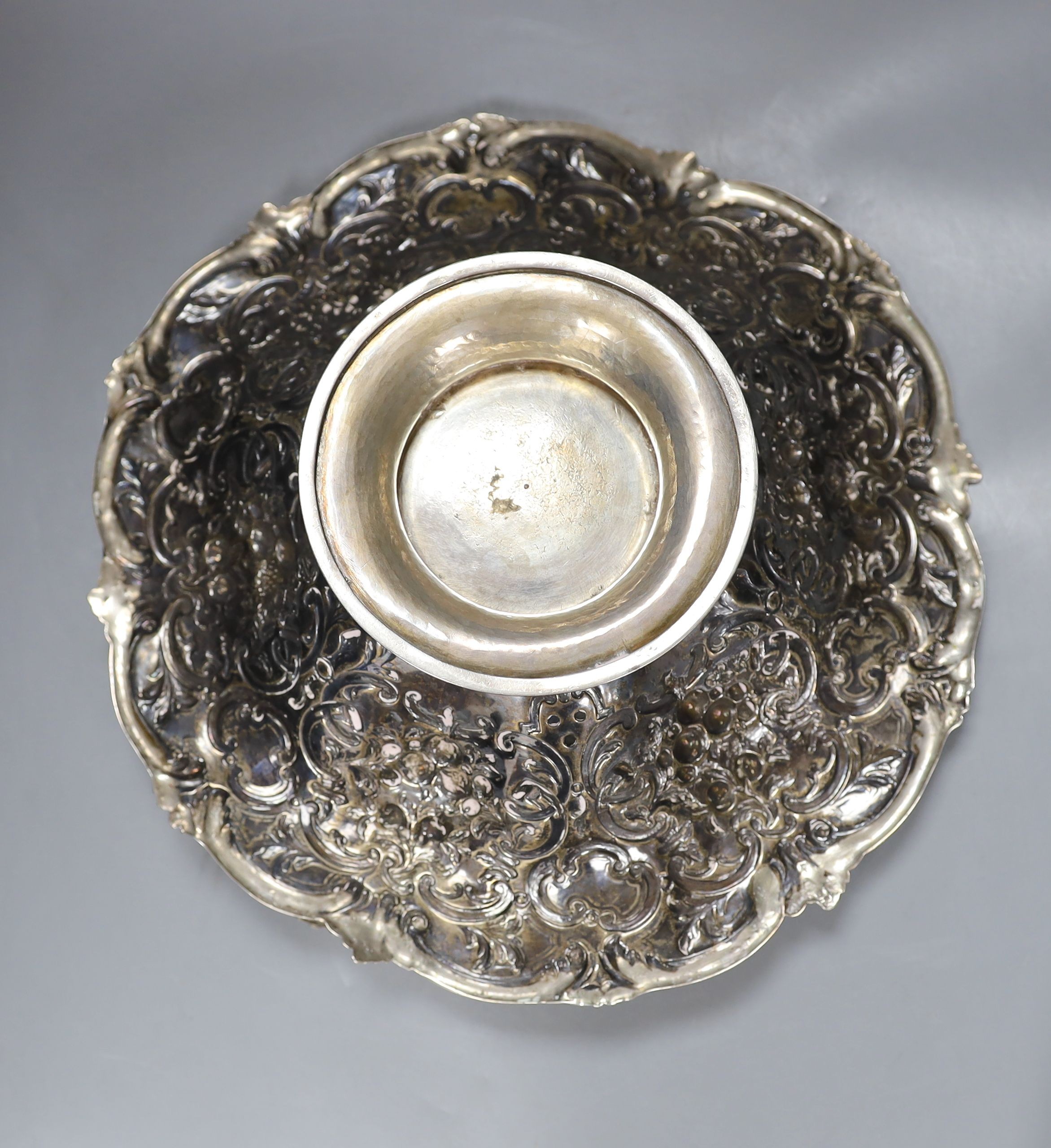 A Victorian Scottish silver fruit basket, embossed with fruit amid scrolls, MS&B, Glasgow, 1861, diameter 32.2cm, 34oz (repairs).